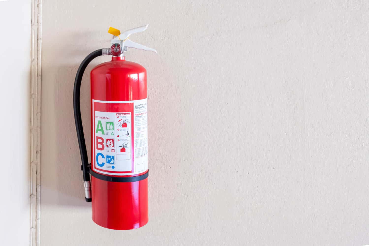 Fire extinguisher system on the wall background, powerful emergency equipment for industrial